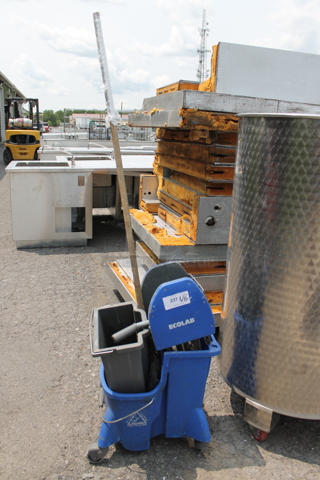 Ecolab Blue Poly Mop Bucket w/ Mop and Wringing  Attachment on Casters.
