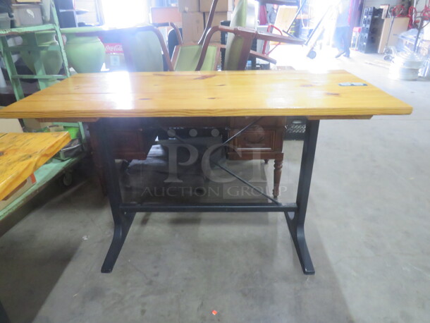 One Wooden Table Top On A Bar Height Black Industrial Base. 72X34X42