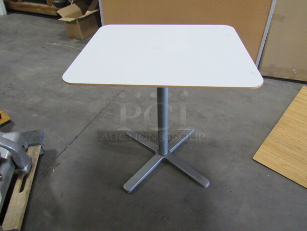 One White Laminate Table Top On Pedestal Base. 28X18X29