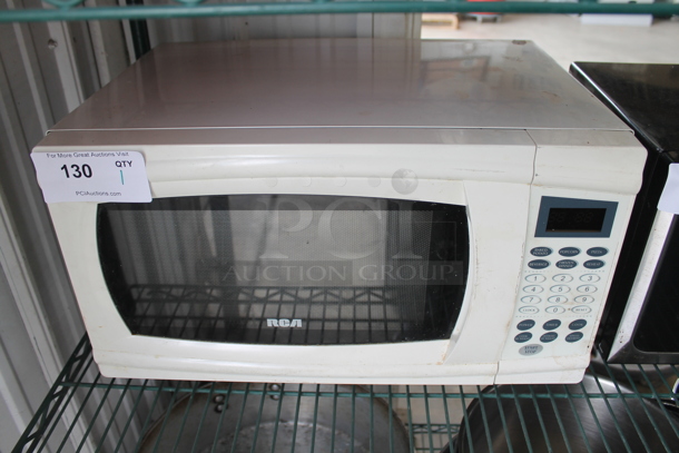RCA RMW1112 Metal Countertop Microwave Oven. 120 Volts, 1 Phase.  - Image 1 of 6