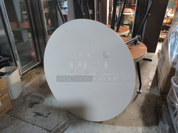 One Round White Laminate Table Top On 4 Metal Legs. 48X29.5 - Image 1 of 1