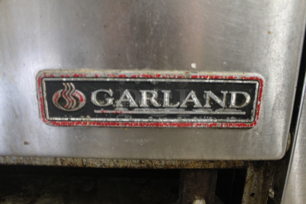 Garland Stainless Steel Commercial Electric Powered Flat Top Griddle w/ Thermostatic Controls, 2 Left Side Burners, Oven, Over Shelf and Back Splash. 208 Volts, 3 Phase. - Image 8 of 9