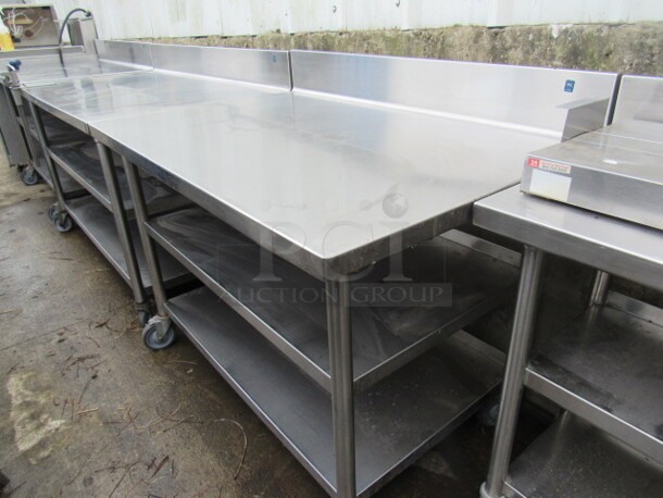 One Stainless Steel Table With 2 Stainless Under Shelves, And A 10lb Can Opener On Casters. 60X32X40