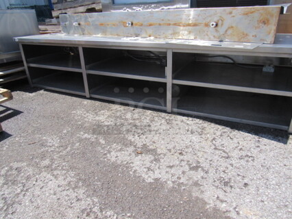 One Stainless Steel Table/Front Counter With 6 Stainless Under Shelves. 128X37X26
