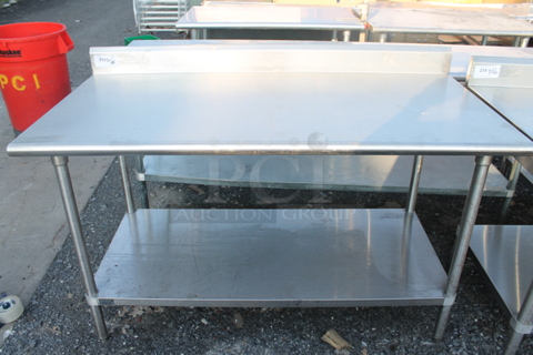 Stainless Steel Commercial Table w/ Back Splash and Under Shelf.
