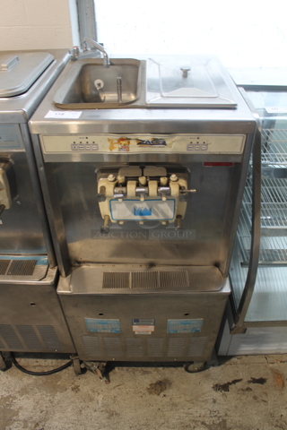 Taylor 754-33 Stainless Steel Commercial Floor Style Water Cooled 2 Flavor w/ Twist Soft Serve Ice Cream Machine on Commercial Casters. 208/230 Volts, 3 Phase.