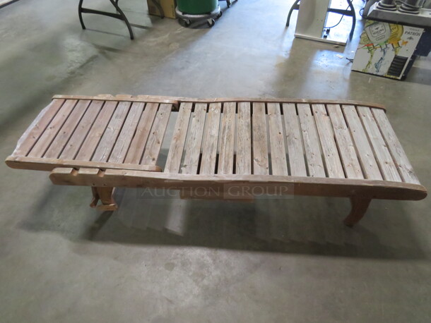 One Adjustable Wooden Chaise Lounger With 2 Wheels, And A Pullout Shelf. Needs A Lil Adjusting. 72X23 - Image 1 of 1