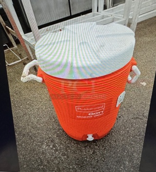 One Orange Igloo Beverage Dispenser Cooler.