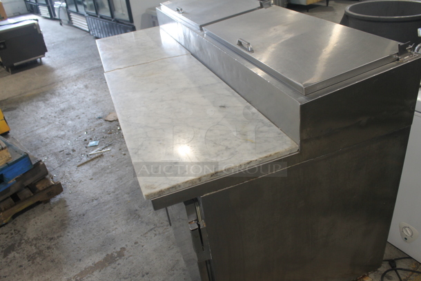 2014 Leader ESPT72SC Commercial Stainless Steel 3-Door Pizza Prep Table With Marble Style Countertop, Lift Up Lids, Plastic Drop-In Bins And Steel Racks On Commercial Casters. 115V. Tested and Powers On But Does Not Get Cold
 - Image 3 of 10